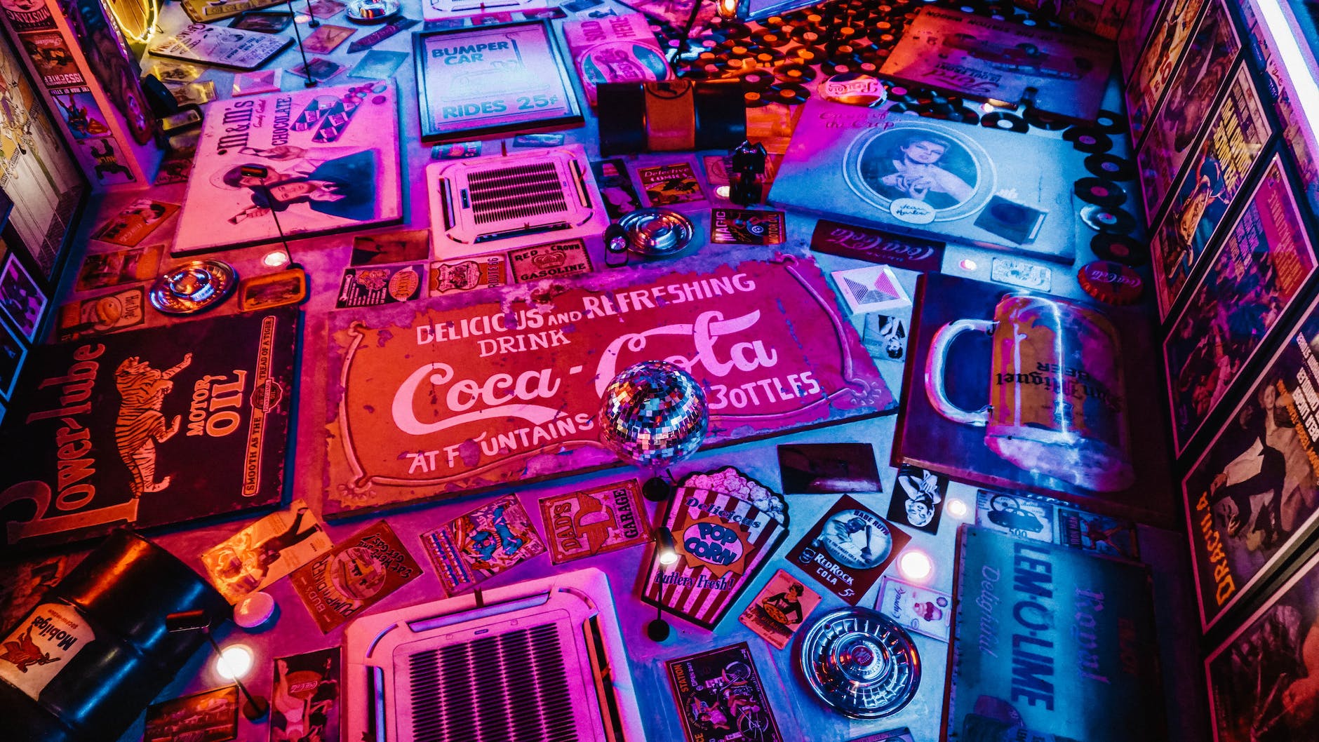 red coca cola signage surrounded by other signages